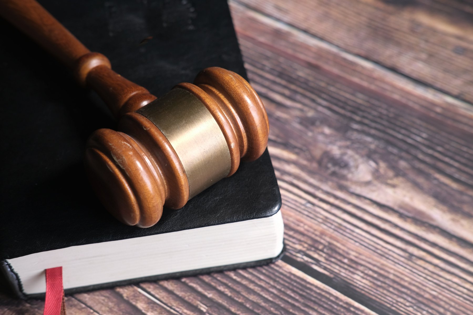 Close up of Gavel on a Book on Table